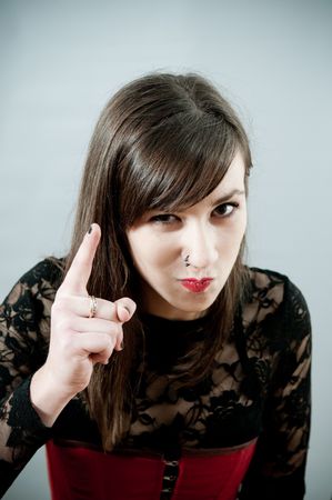 Girl pointing with her fingerの写真素材