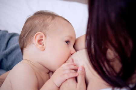 Mother breast feeding her baby boyの写真素材