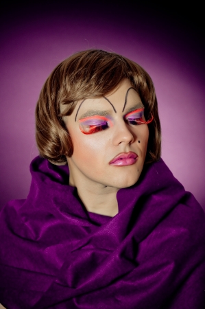 Drag queen with closed eyes wearing wigの写真素材