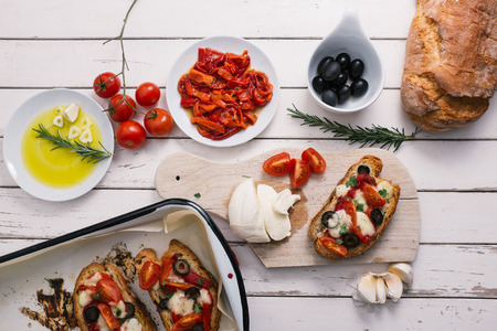 Bruschetta with tomatoes, pepper, mozzarella and garlic