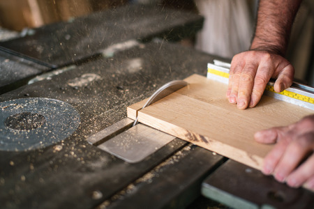 Carpenter working on the circular sawの写真素材