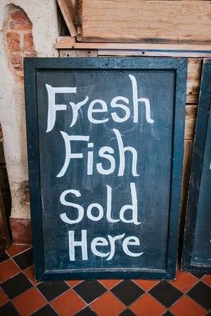 Fresh fish sold here signの写真素材
