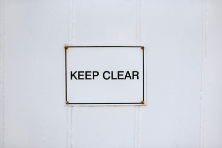 Metal keep clear sign on withe backgroundの写真素材