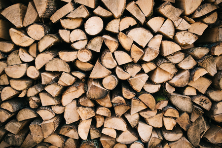 Stacked firewood backgroundの写真素材