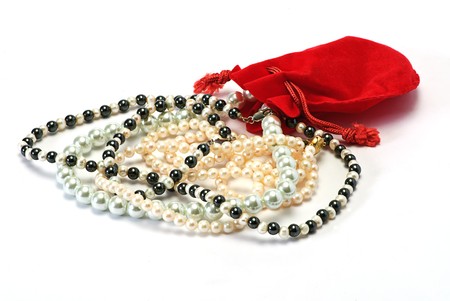 pearls and red pocket on white isolatedの写真素材