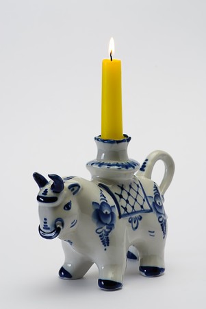 porcelain  bull candlestick isolated on whiteの写真素材