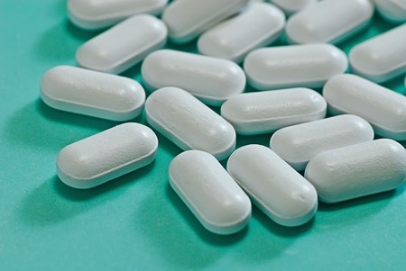 medical  pill  on blue isolated