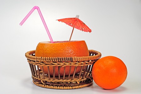 grapefruit in basket and orangeの写真素材