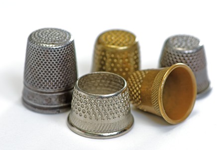 five thimbles on white isolated