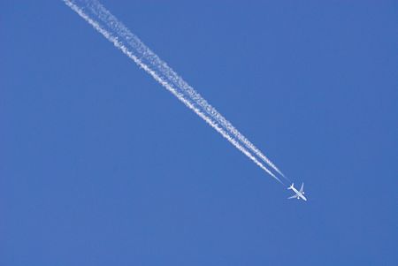   white plane high in turn blue skyの写真素材