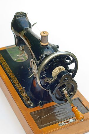 Old sewing machine isolated on white background