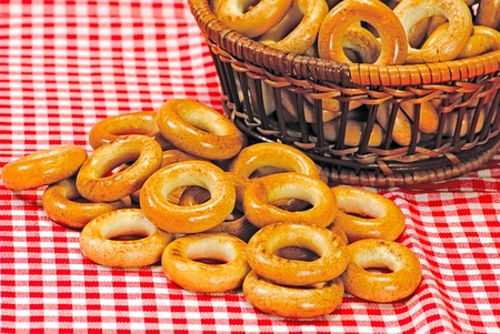 Basket with bread ring on a motley  backgroundの写真素材