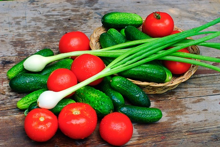 assorted fresh vegetables on a wooden tableの写真素材