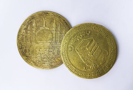 Old coins isolated on white backgroundの写真素材