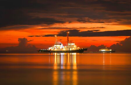 PORT DICKSON. MALAYSIA : Tugboat at the middle of the sea with beautiful sunset December 15, 2019のeditorial素材