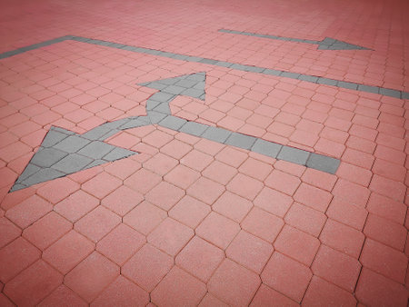 Path direction arrows on the groundの写真素材