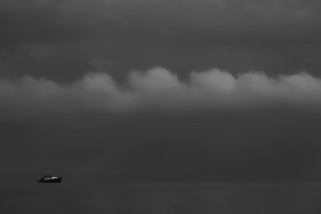 Black and white tone. Ships docked at the middle of the sea