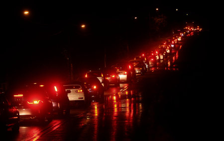Rows of vehicles stuck in traffic jams at night