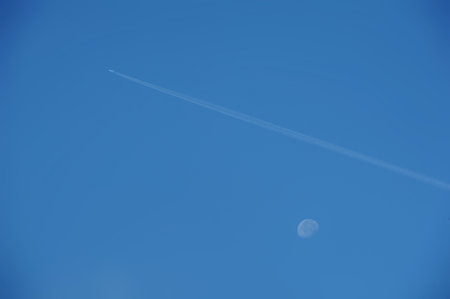 The plane flies high in the air