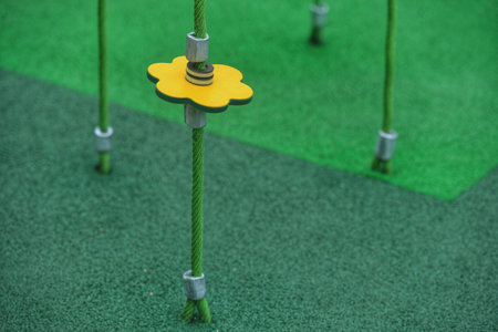 Yellow flower on green artificial turf background, ready for golf game.