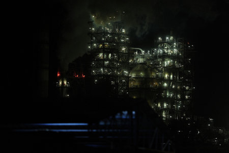 MALAYSIA, PORT DICKSON - A gas flare at an oil refinery with lighting and dark Background on February 08, 2023のeditorial素材