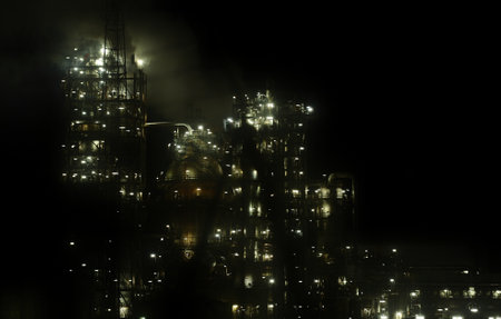 MALAYSIA, PORT DICKSON - A gas flare at an oil refinery with lighting and dark Background on February 08, 2023のeditorial素材