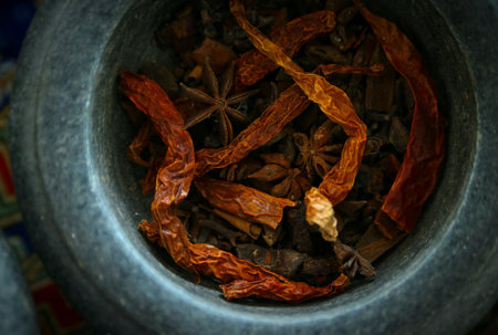 Dried chilies in a stone mortarの写真素材