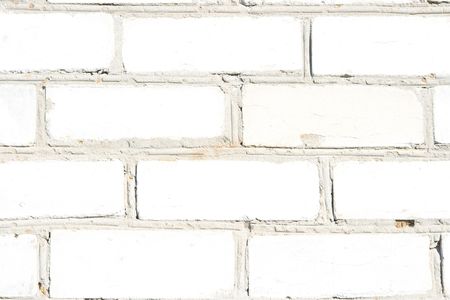 Texture of a wall of the house from a white brick. A background