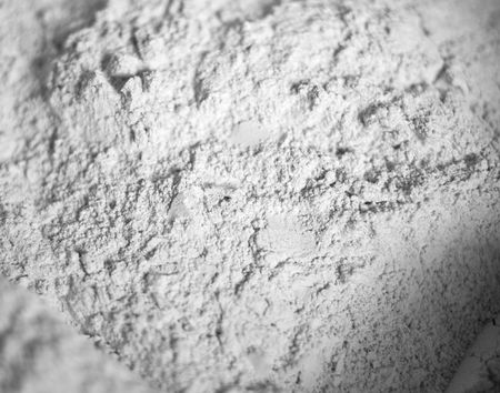 The white scattered powder similar to a flour. Abstract background. Shallow DOFの写真素材