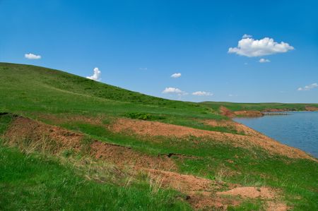 Summer landscape with quiet water of lake and hills. Russia, Bashkortostanの写真素材