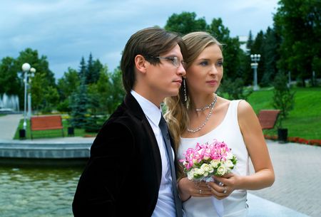 Young couple against summer landscapeの写真素材
