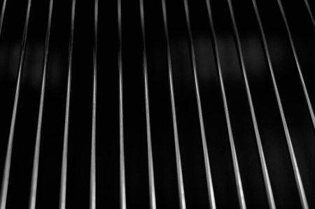 Metal lattice on a black. Abstract background, shallow DOFの写真素材
