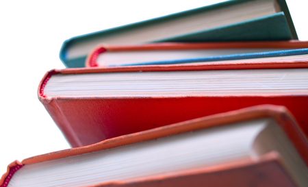 Pile of old books on white background. Isolated, shallow DOFの写真素材
