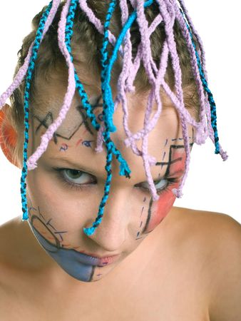 Portrait of beautiful young girl with plaits and geometrical makeup on white backgroundの写真素材