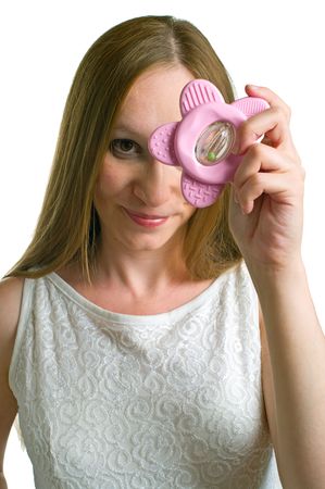 Portrait of young pregnant women with toy in hand on white background. Isolation, focus on toyの写真素材