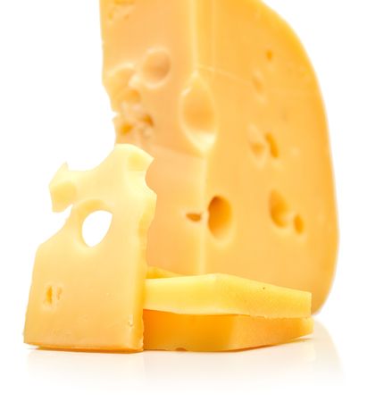 The big piece and slices of cheese on white background. Isolationの写真素材