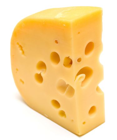 The big piece of cheese on white background. Isolation, shallow DOFの写真素材