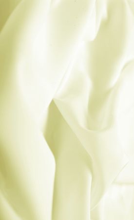 Abstract background yellow silk fabric with waves. Shallow DOFの写真素材