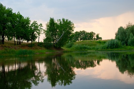 The beautiful sunset on the lake. Shallow DOFの写真素材