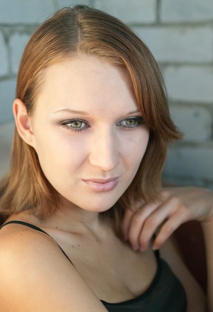 Portrait of the beautiful girl on a grey background. Shallow DOF の写真素材