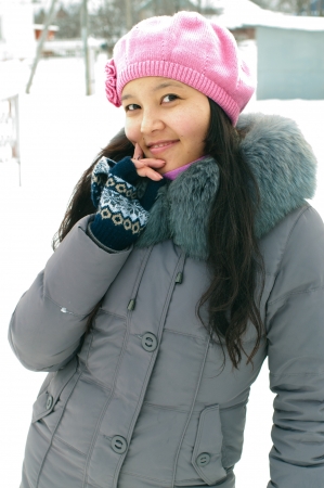 Attractive young girl in wintertime outdoorの写真素材
