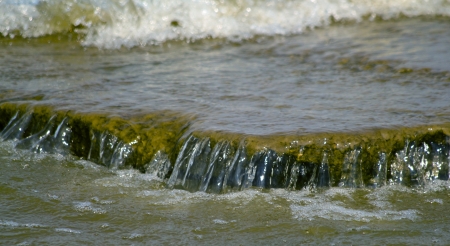 Waves of river and rocks. The natural background, shallow DOFの写真素材