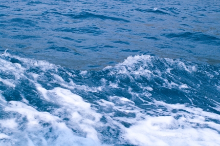Blue sea with waves and foam. Shallow DOFの写真素材