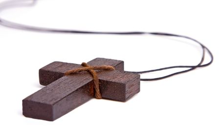 A wooden cross isolated on a white background. Can be used for any religious cencept