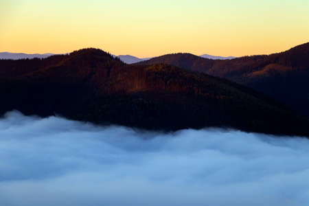 Majestic sunset with fog in the mountains landscape.Carpathian, Ukraine, Beautiful Background