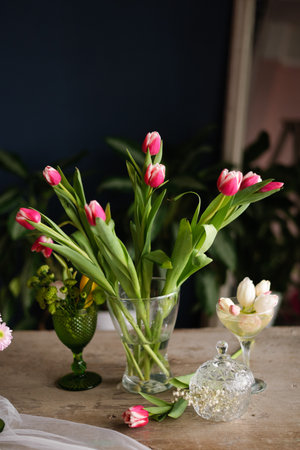 Beautiful tulip bouquet in a vase on the table