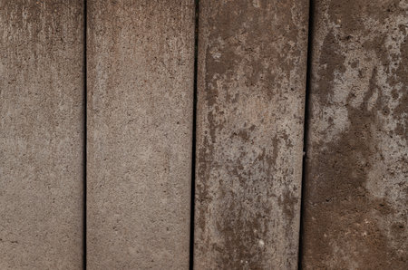 Surface of old brown chipped and deteriorated wood textureの写真素材