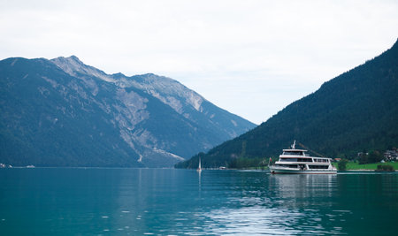 Touristic boat on the turquoise waters of Achen Lake (Achensee), Tirol, Austria, Europeの写真素材