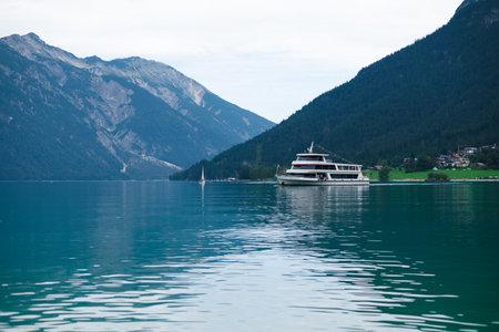 Touristic boat on the turquoise waters of Achen Lake (Achensee), Tirol, Austria, Europeの写真素材