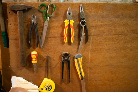 Vintage Tools Hanging On A Wall In A Tool Shed Or Workshopの写真素材